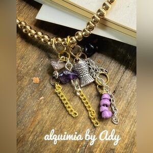 Amethyst and sardine fish charm adorned bracelet